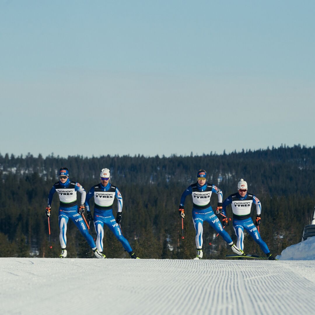 Ski team skiing towards camera
