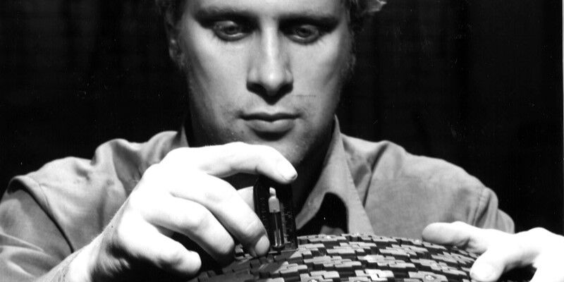 Closeup of a person inspecting a tire's studs