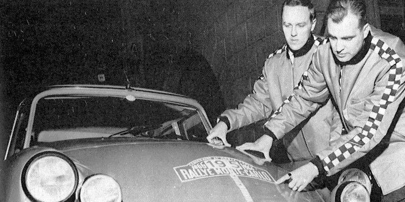 Two race drivers with their race car