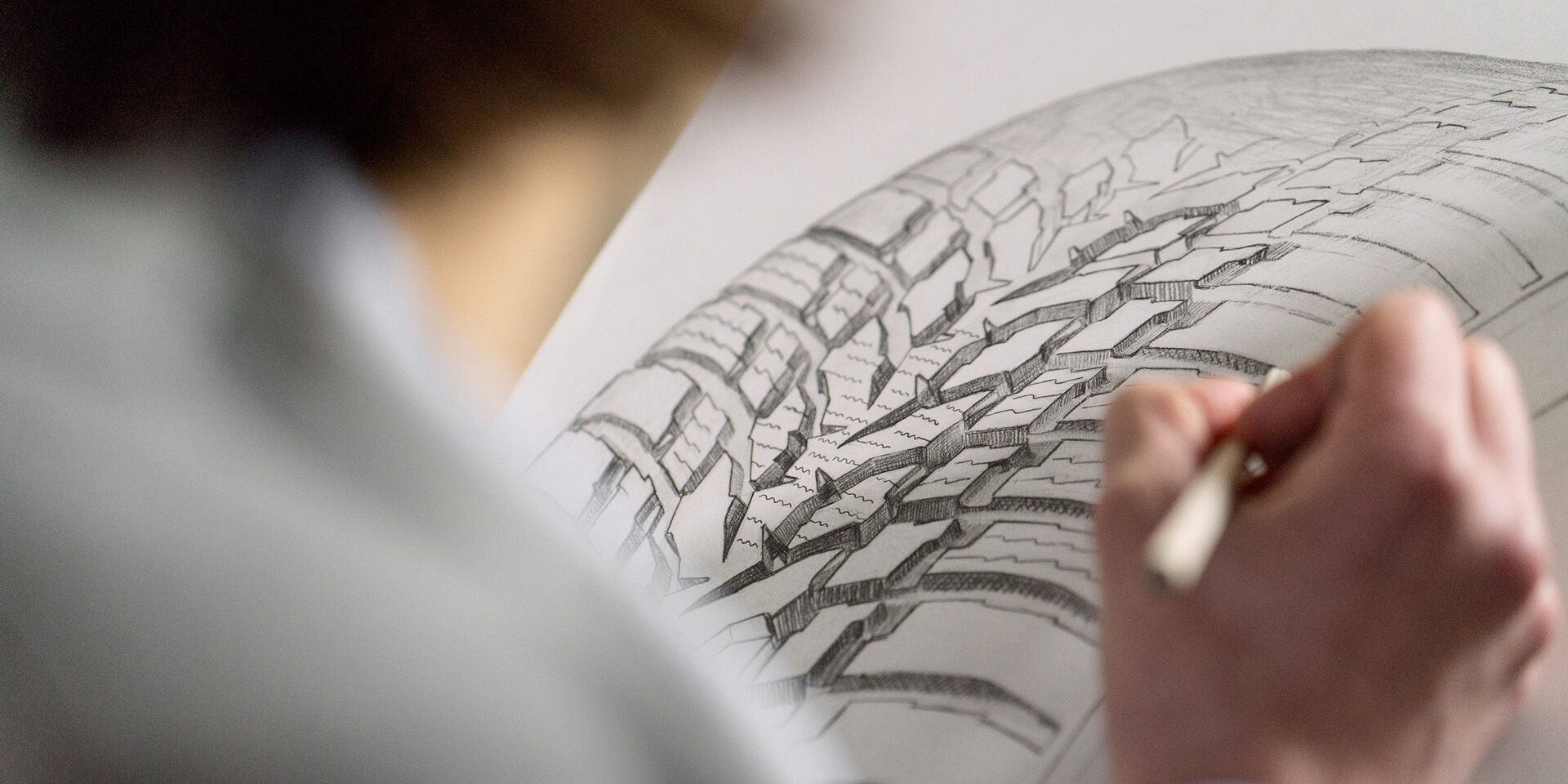 person drawing tire pattern