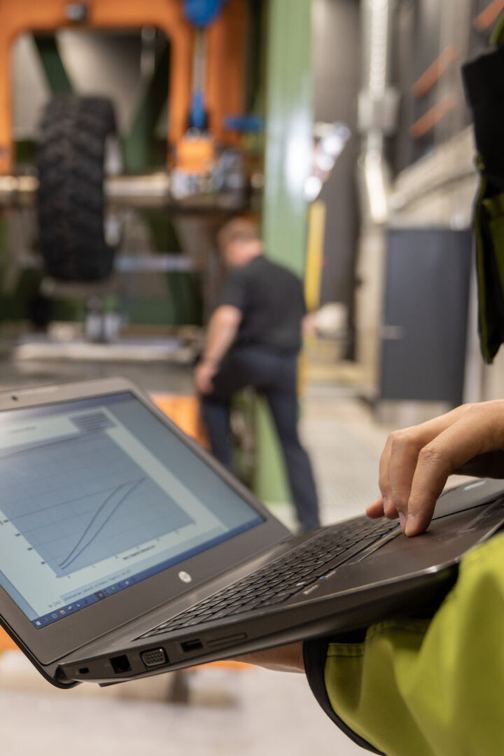 closeup person handling laptop at factory