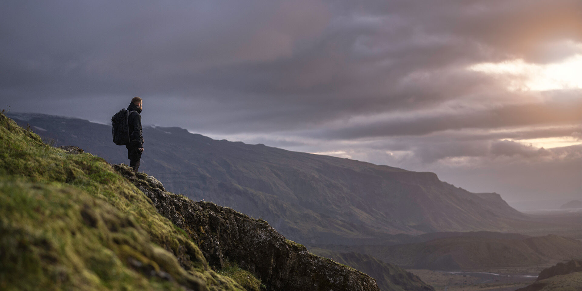 man gleaming over a mountain range 