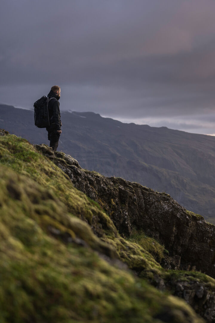 man gleaming over a mountain range 