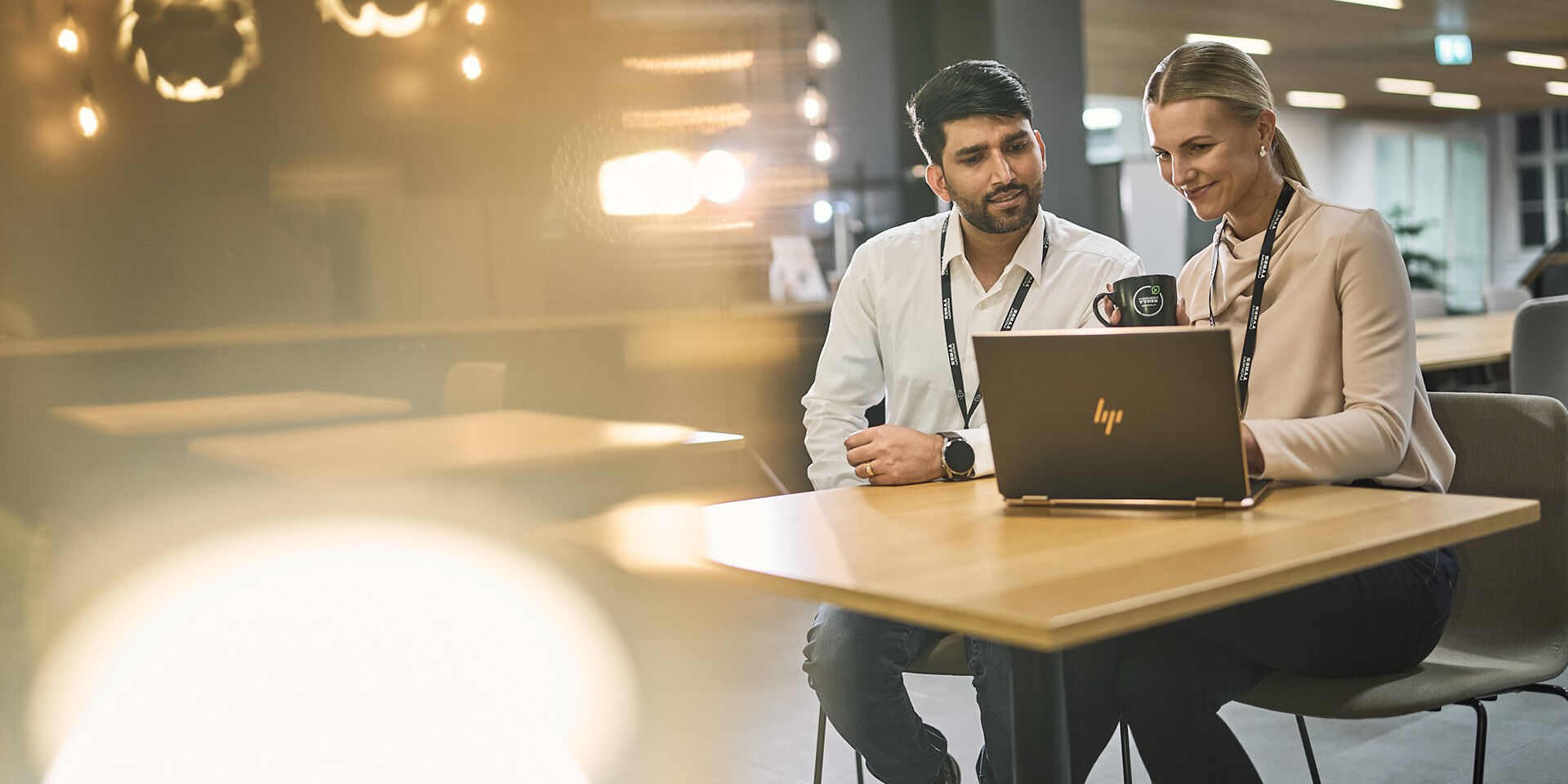 Two employees coworking and discussing