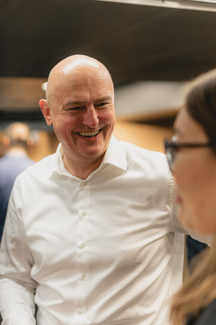 Smiling Nokian Tyres' employees at an event.