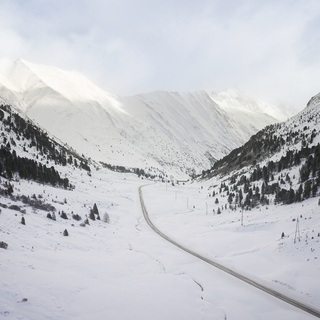 Wintery mountain range shot from aerial perspective