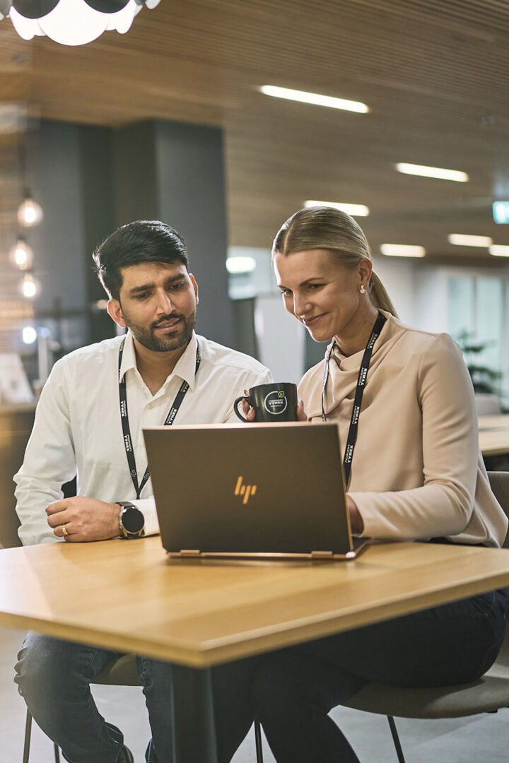 Two employees coworking and discussing