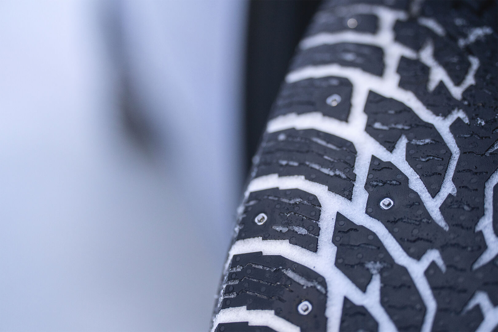 A studded winter tire close-up