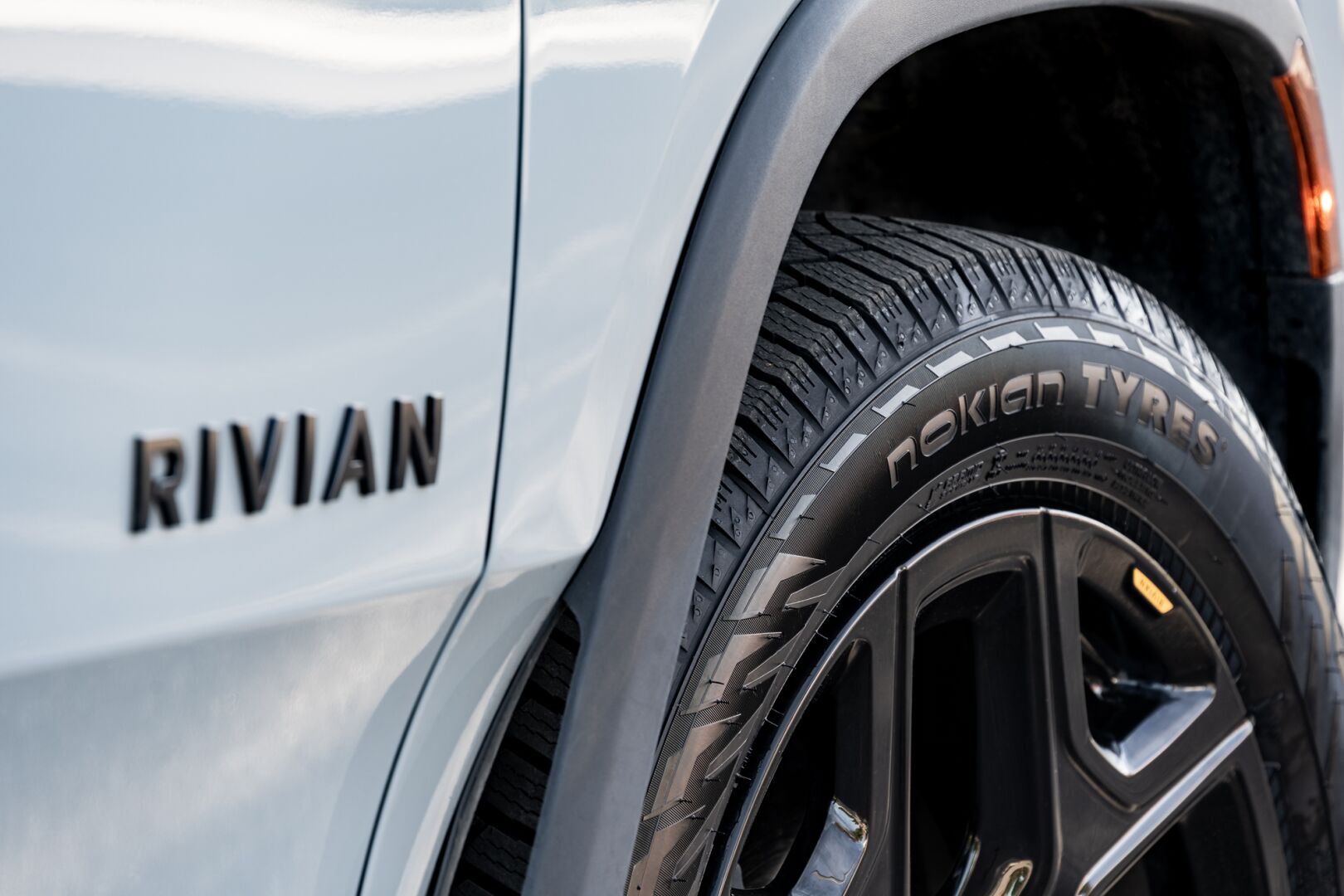 Side profile shot of the Nokian Tyres Hakkapeliitta R5 SUV winter tire on a Rivian R1